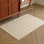 Thảm dệt Dash Rug màu trắng kem tối giản trên sàn gỗ